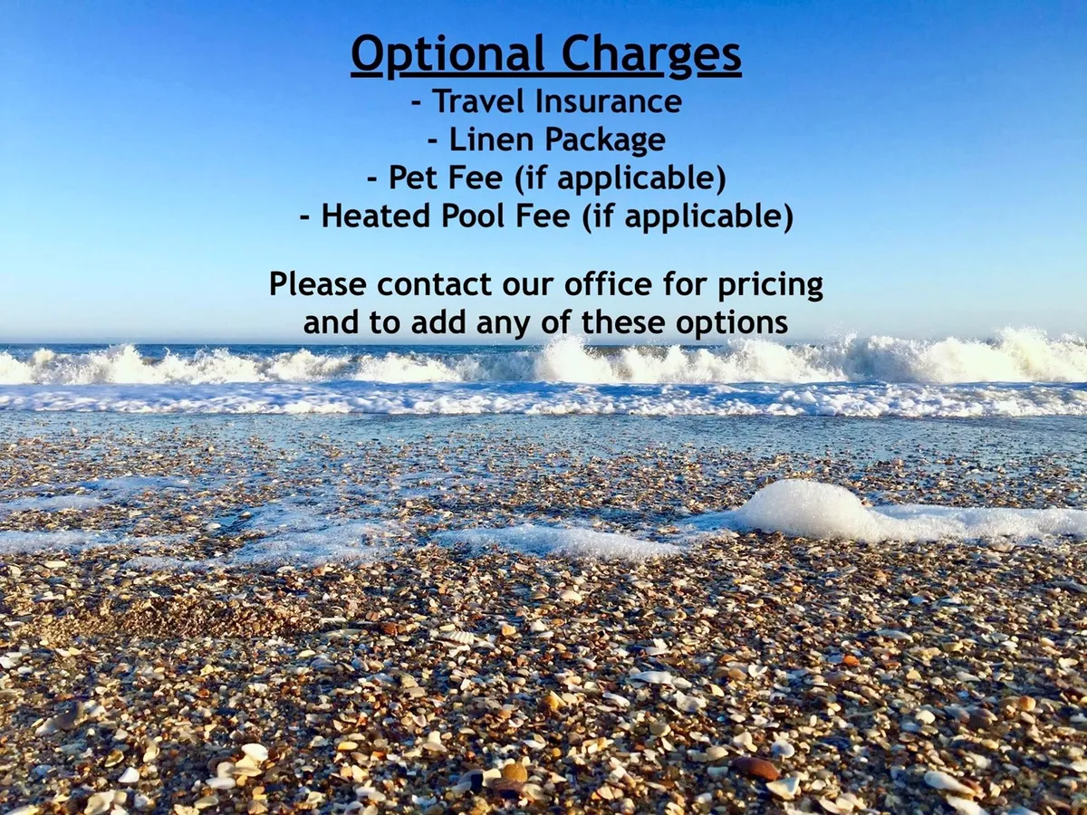 A dreamy stretch of sandy beach meets gentle ocean waves, with seashells scattered along the shoreline under a clear sky. The view evokes the inviting, family-friendly atmosphere of North Topsail Beach—perfect for building sandcastles, collecting shells, and splashing in the surf.